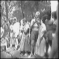 [laos_kwang_si_tourists_and_monks.gif]
